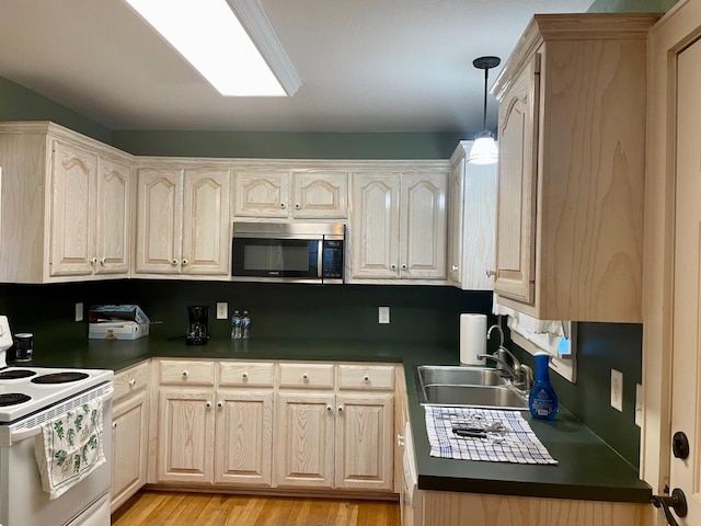 kitchen featuring electric stove, pendant lighting, sink, light brown cabinets, and light hardwood / wood-style flooring