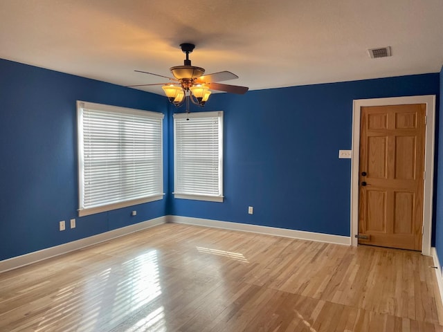 spare room with light hardwood / wood-style flooring and ceiling fan