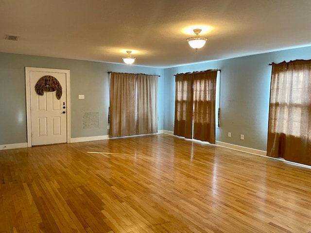 foyer entrance with hardwood / wood-style flooring