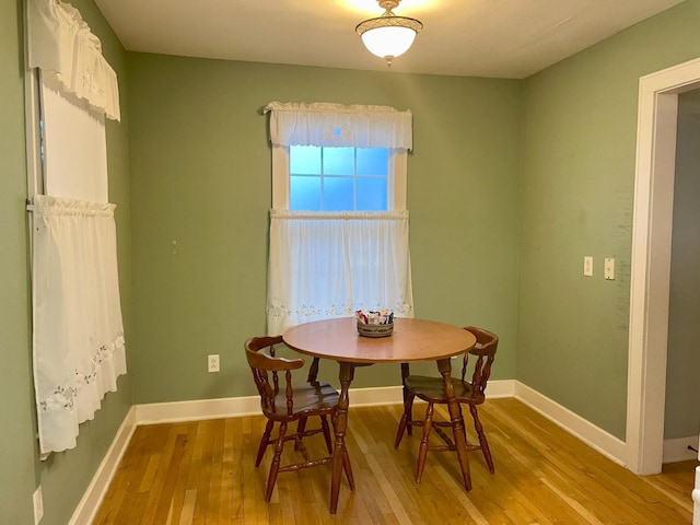 dining space featuring light wood-type flooring