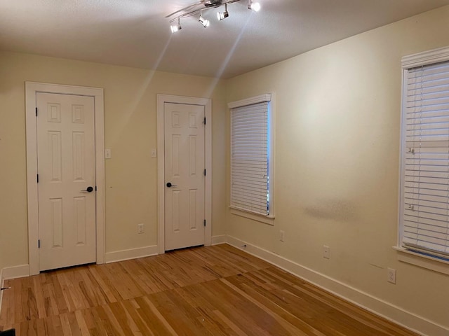 spare room with light hardwood / wood-style floors