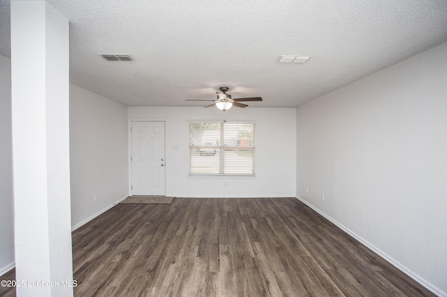 4638 Fordham St, Lubbock, TX 79416 - unfurnished room featuring dark wood-style flooring, a ceiling fan, and a textured ceiling
