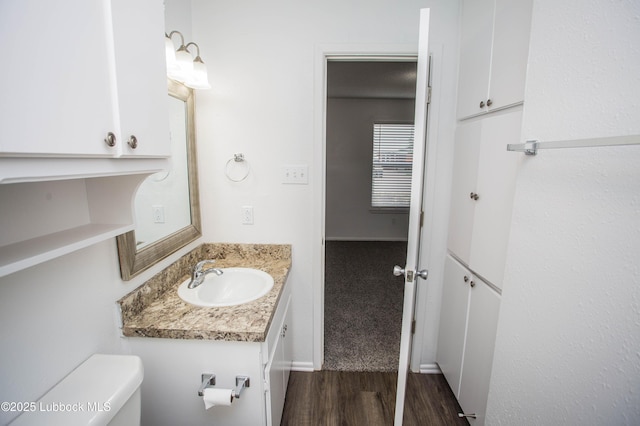 4638 Fordham St, Lubbock, TX 79416 - bathroom featuring vanity and wood finished floors