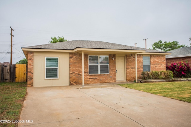 4638 Fordham St, Lubbock, TX 79416 - ranch-style home with brick siding, a patio, and a shingled roof