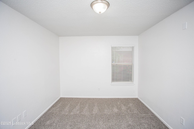 4638 Fordham St, Lubbock, TX 79416 - carpeted empty room with baseboards and a textured ceiling
