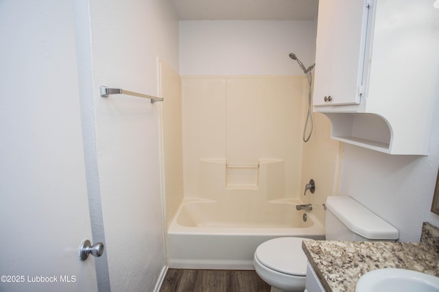 4638 Fordham St, Lubbock, TX 79416 - full bathroom featuring vanity, wood finished floors, and bathing tub / shower combination