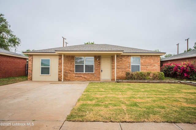 4638 Fordham St, Lubbock, TX 79416 - view of front of home featuring a front lawn, brick siding, roof with shingles, and driveway