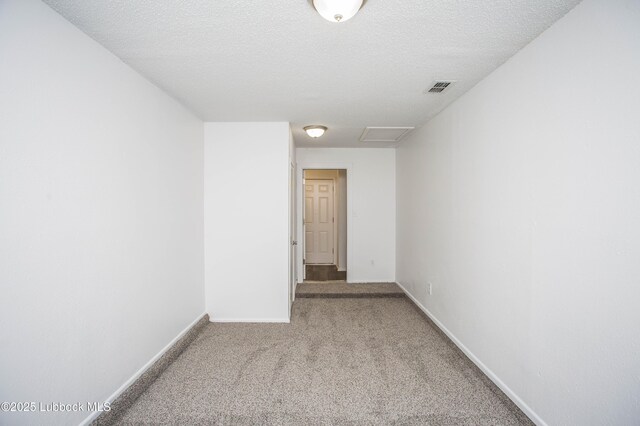 4638 Fordham St, Lubbock, TX 79416 - carpeted empty room with attic access and a textured ceiling