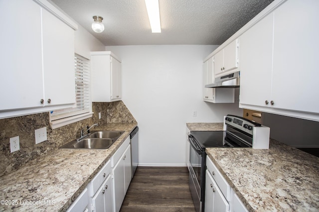 4638 Fordham St, Lubbock, TX 79416 - kitchen with appliances with stainless steel finishes, under cabinet range hood, white cabinetry, dark wood finished floors, and backsplash