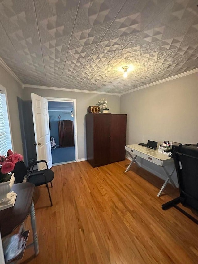 interior space with crown molding and hardwood / wood-style floors