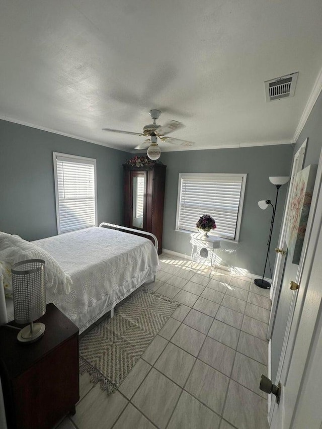 bedroom featuring crown molding and ceiling fan