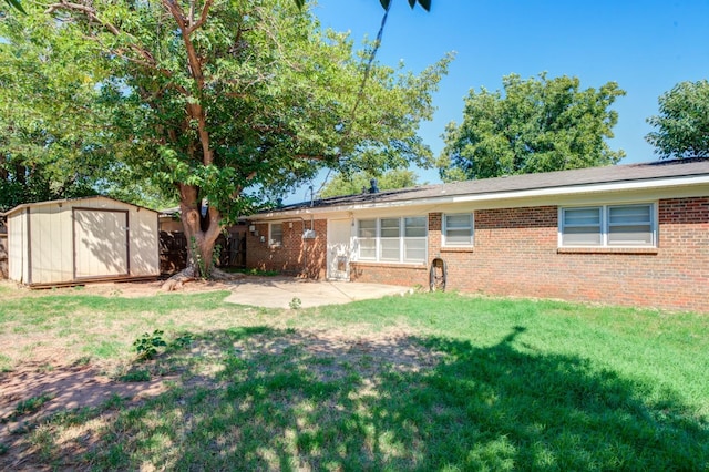 exterior space featuring a storage shed, a yard, and a patio