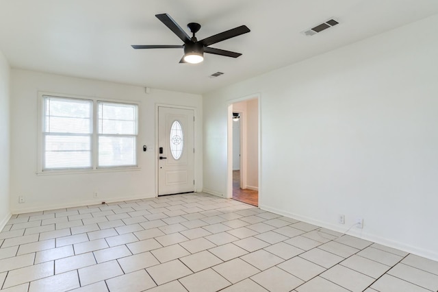 foyer entrance with ceiling fan