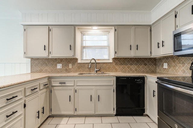 kitchen with sink, crown molding, stainless steel appliances, and decorative backsplash