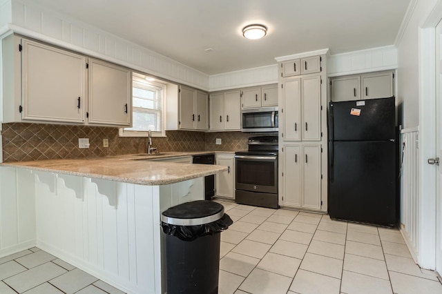 kitchen with black appliances, sink, decorative backsplash, light tile patterned floors, and kitchen peninsula