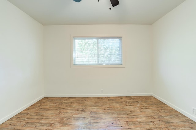 empty room with light hardwood / wood-style flooring and ceiling fan