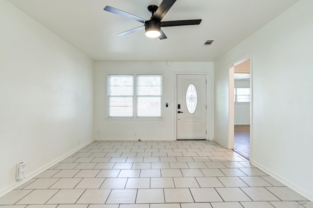 foyer entrance with ceiling fan