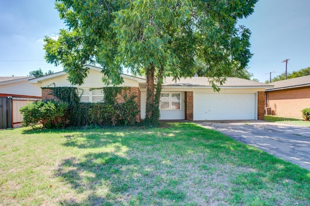 ranch-style house featuring a garage and a front lawn