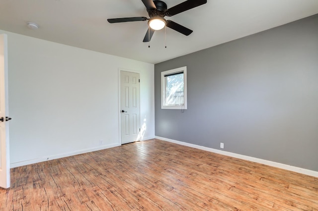 spare room with ceiling fan and light hardwood / wood-style floors