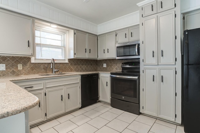 kitchen with tasteful backsplash, sink, ornamental molding, and black appliances