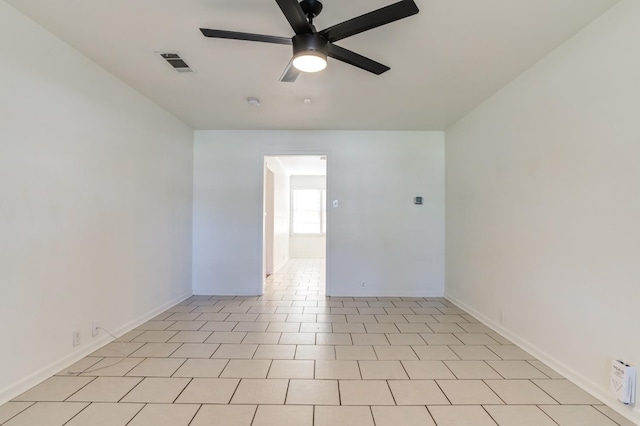 spare room with ceiling fan