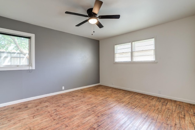 unfurnished room featuring ceiling fan and light hardwood / wood-style floors