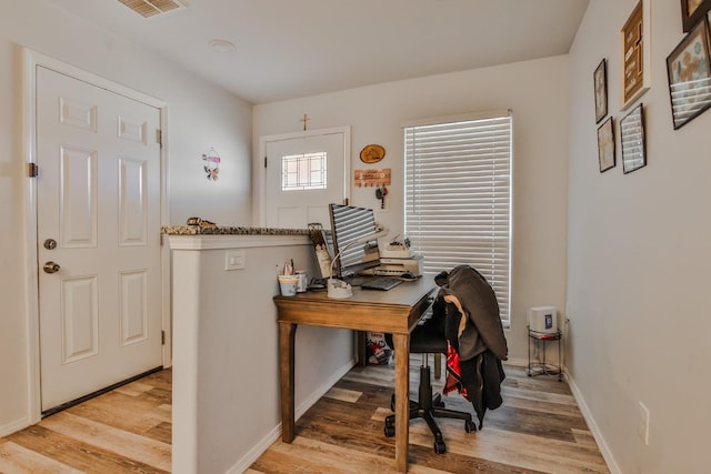 office space with light wood-type flooring