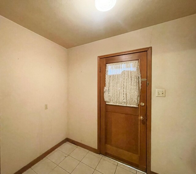 entryway featuring light tile patterned floors