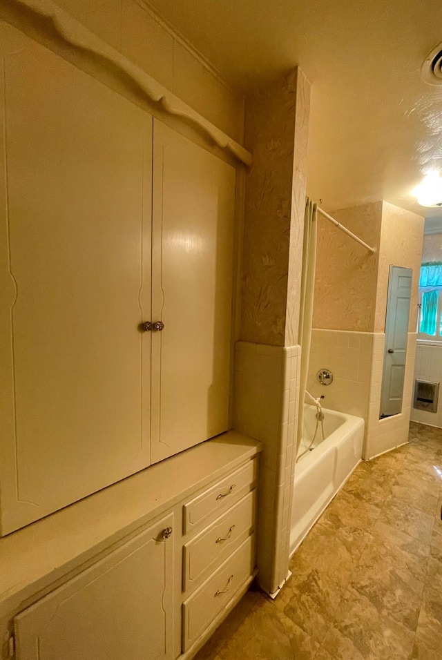 bathroom with shower / tub combination