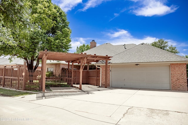 9805 Savannah Ave, Lubbock, TX 79424 - view of front of home with brick siding, a garage, driveway, and a shingled roof