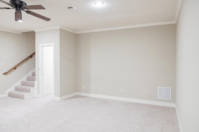9805 Savannah Ave, Lubbock, TX 79424 - spare room with ceiling fan, crown molding, carpet flooring, stairs, and baseboards