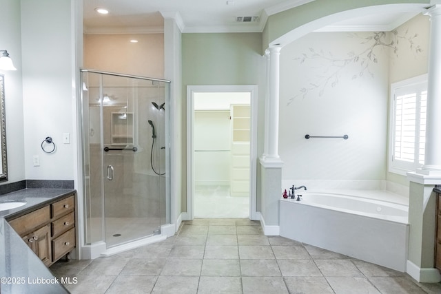 9805 Savannah Ave, Lubbock, TX 79424 - bathroom featuring vanity, crown molding, a stall shower, ornate columns, and a garden tub