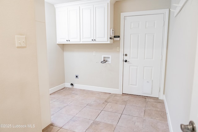 9805 Savannah Ave, Lubbock, TX 79424 - laundry room with hookup for an electric dryer, washer hookup, baseboards, cabinet space, and light tile patterned floors