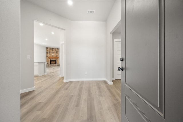 hallway with light wood-type flooring