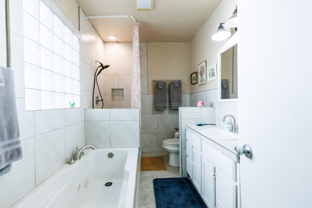 bathroom featuring vanity, tile walls, tile patterned floors, and toilet