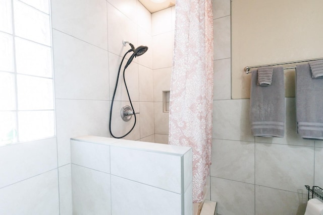 bathroom featuring a shower with curtain