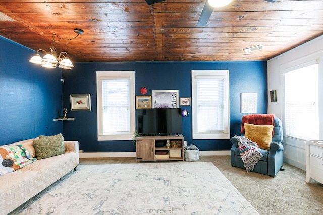 carpeted living room with wood ceiling and a wealth of natural light