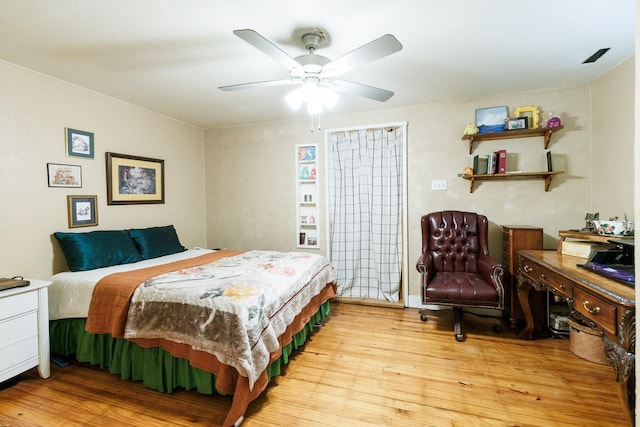 bedroom featuring light hardwood / wood-style floors and ceiling fan