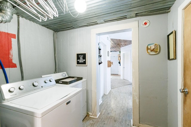 laundry area with light wood-type flooring and independent washer and dryer