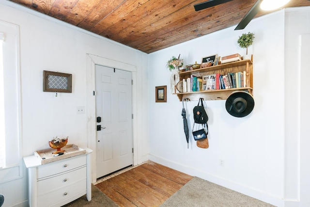 entrance foyer with wooden ceiling and light hardwood / wood-style flooring