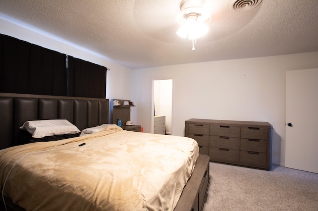 5426 9th St, Lubbock, TX 79416 - bedroom featuring light colored carpet, ceiling fan, and connected bathroom
