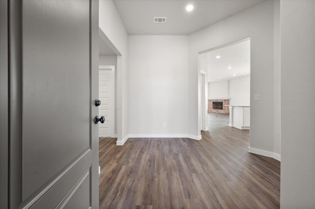 hall with dark hardwood / wood-style floors