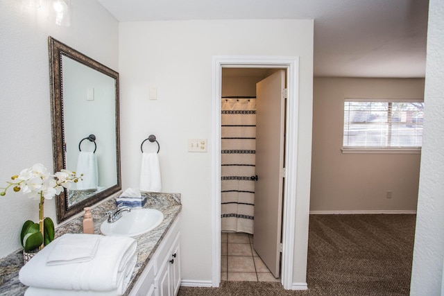 bathroom with tile patterned floors and vanity