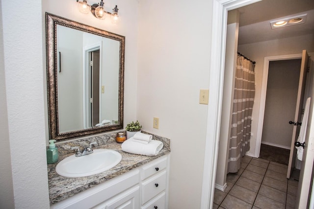 bathroom with vanity and tile patterned floors