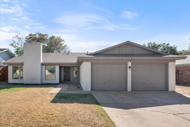 ranch-style house featuring a garage and a front yard