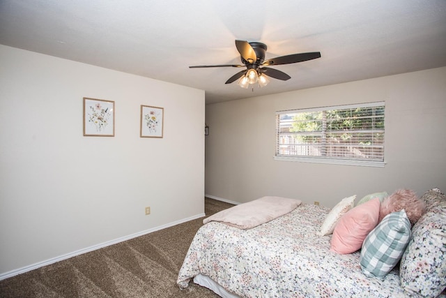 bedroom featuring dark carpet and ceiling fan