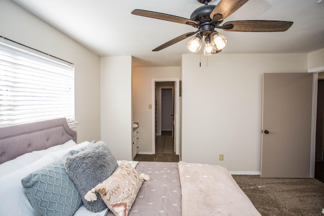 carpeted bedroom with ceiling fan