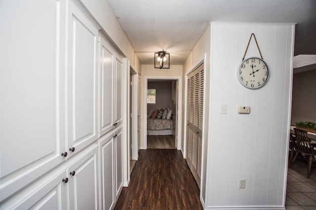 hall featuring dark wood-type flooring