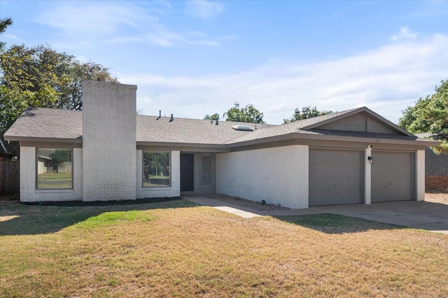 single story home featuring a garage and a front yard