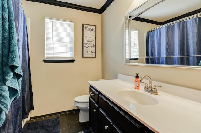 bathroom with ornamental molding, toilet, curtained shower, and vanity